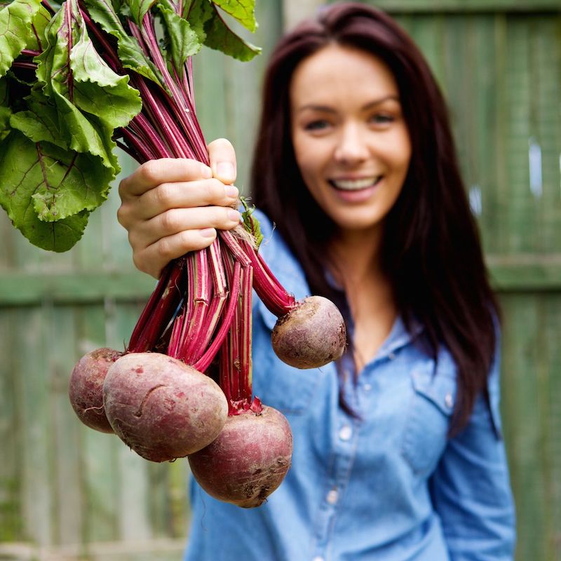 Happy girl with beetroots